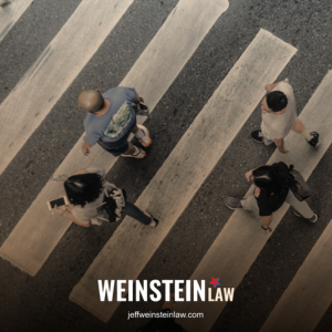 Pedestrians in Tyler, TX crossing the street in a designated crosswalk
